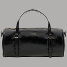 Borsa bauletto Guess Taylor Mini con stampa monogramma e dettagli neri