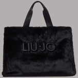 Borsa tote grande in pelliccia nera con manici e logo Liu Jo frontale.