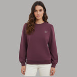 Felpa Liu Jo in scuba bordeaux con logo strass, girocollo, dettaglio cuciture e maniche a palloncino