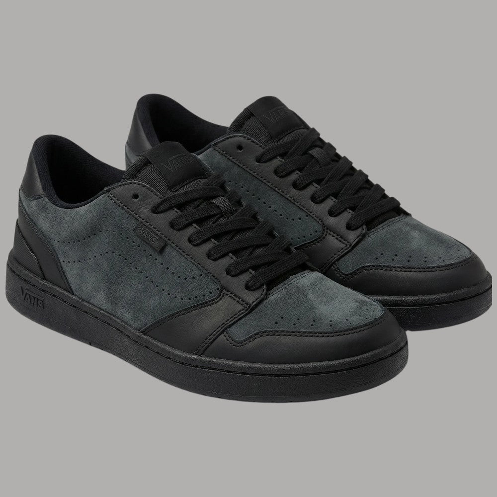 Sneakers Vans grigie e nere con suola bianca e dettagli laterali