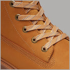 Stivale Timberland con plateau in giallo, dettaglio lacci e occhielli