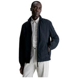 Giacca a vento Calvin Klein blu scuro, zip frontale e tasche con patta