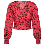 Blusa rossa a maniche lunghe con stampa animalier nera e scollo a V annodato